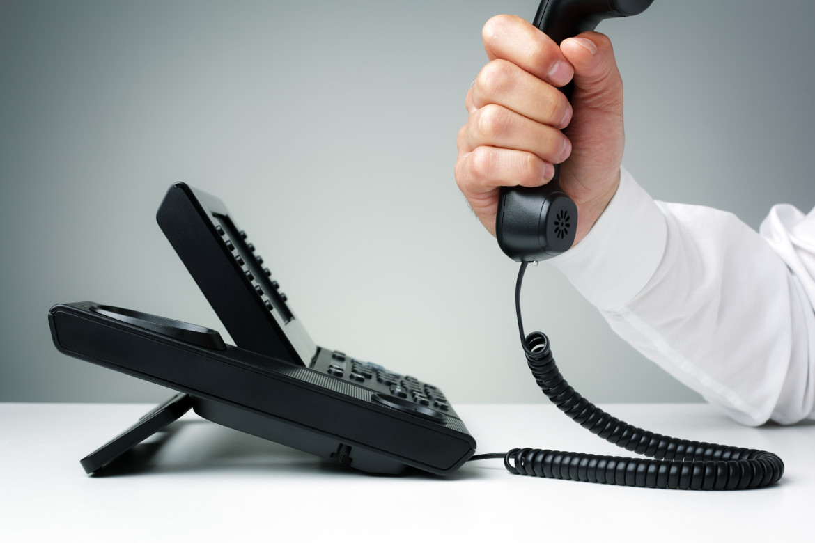 businessman on business landline telephone in an office concept